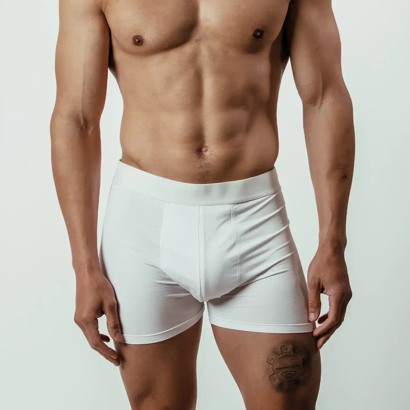 White bamboo boxer briefs on male model front view against plain background