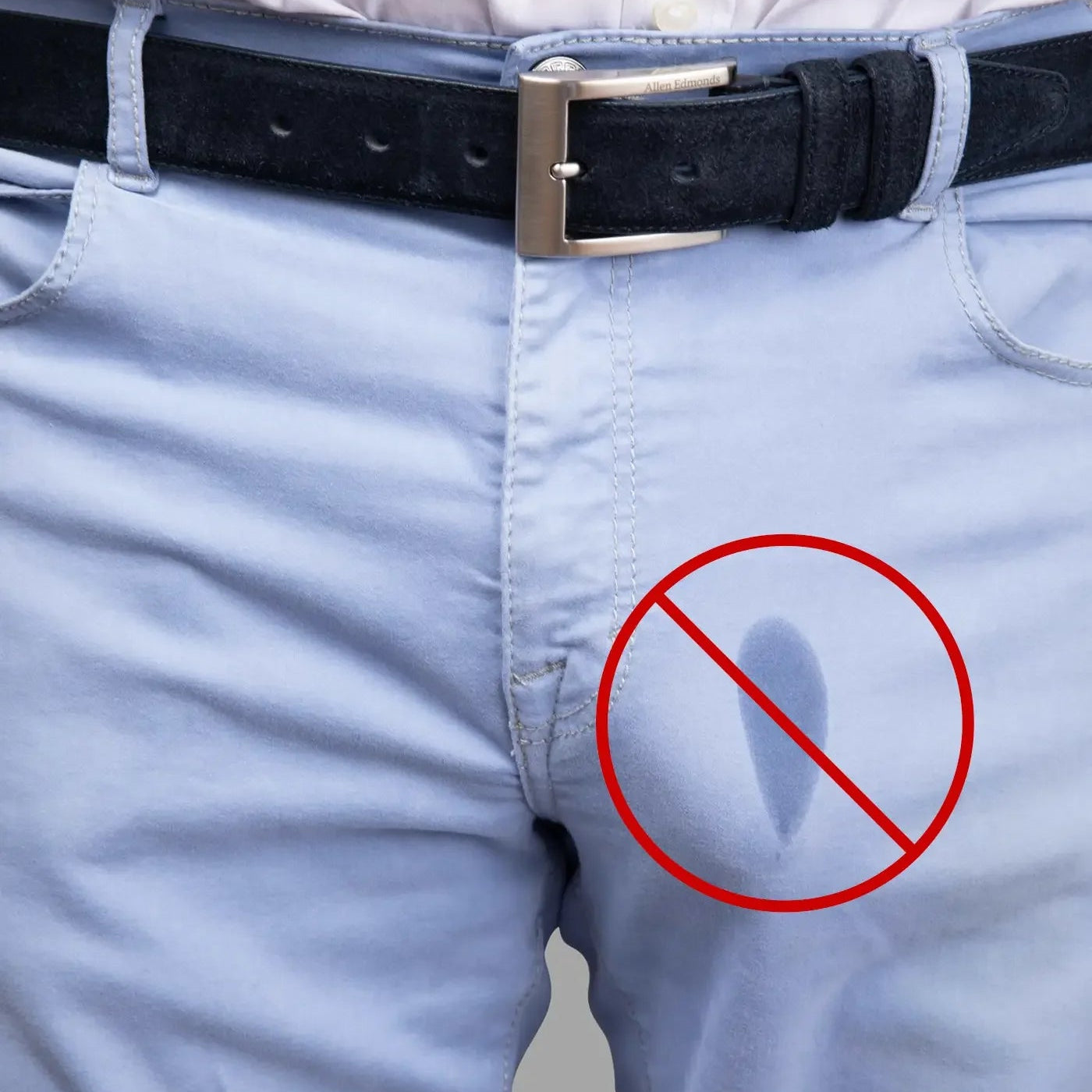 Light blue pants with a wet spot crossed out, anti-drip underwear concept.